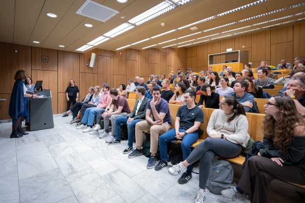 Enlarged view: Audience listens to a person giving a presentation