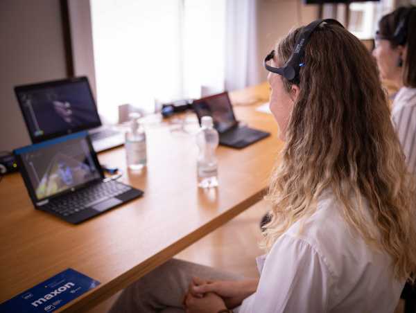 Person wears a headset with which you can control a game via brain waves