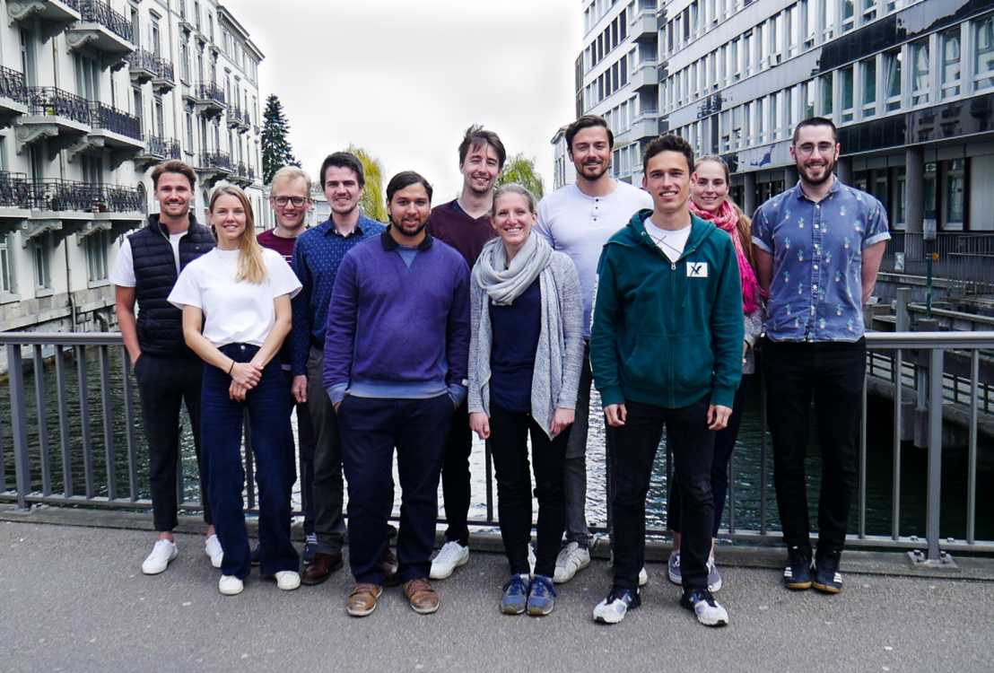 Enlarged view: Team photo with 11 people in front of building