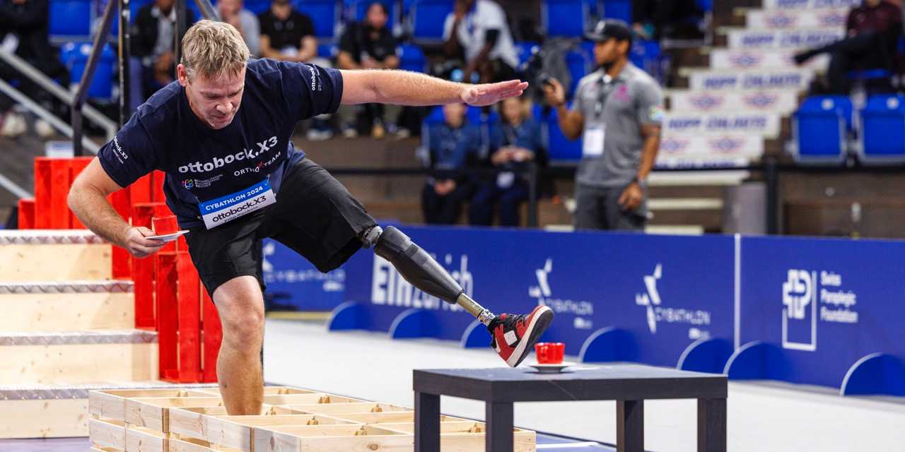 Man with leg protheses runs task during cybathlon 2024