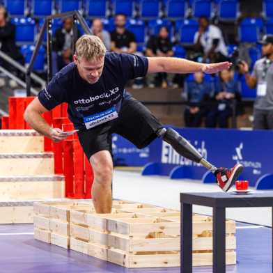 Man with leg protheses runs task during cybathlon 2024